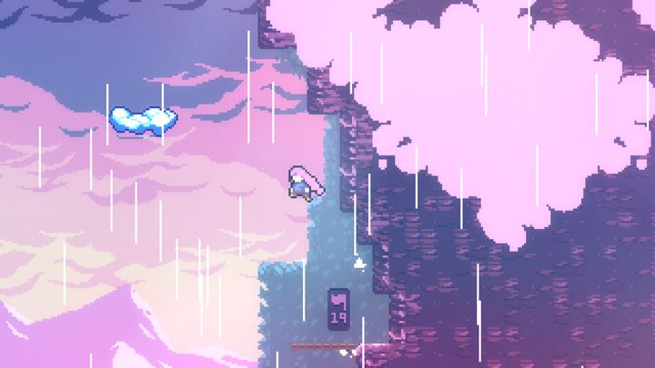 The player platforming in the mountains