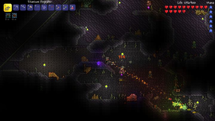 A player fighting monsters in a cave